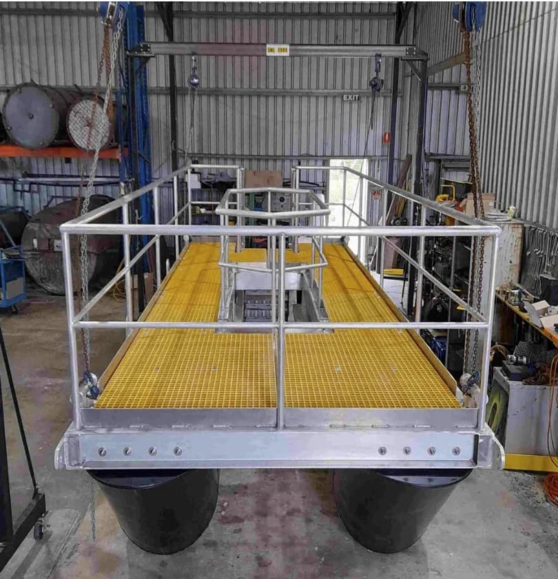 Pump install barge deck and handrails over the twin HDPE pontoons