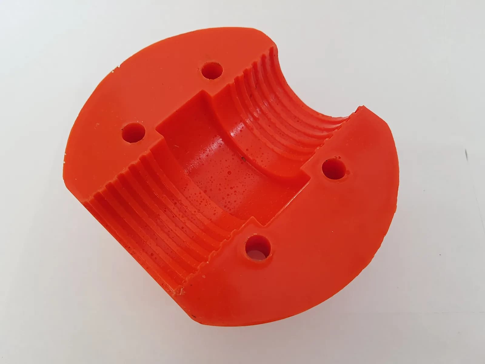 Cable stopper half-section — internal grip geometry