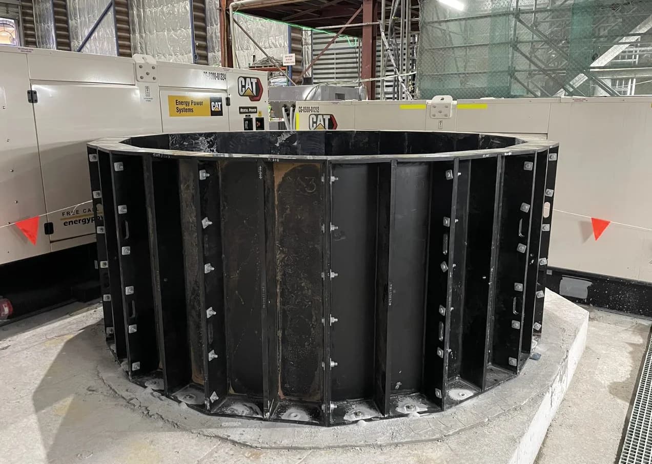 Base ring of a modular stacked HDPE Polyduct shaft on a concrete plinth