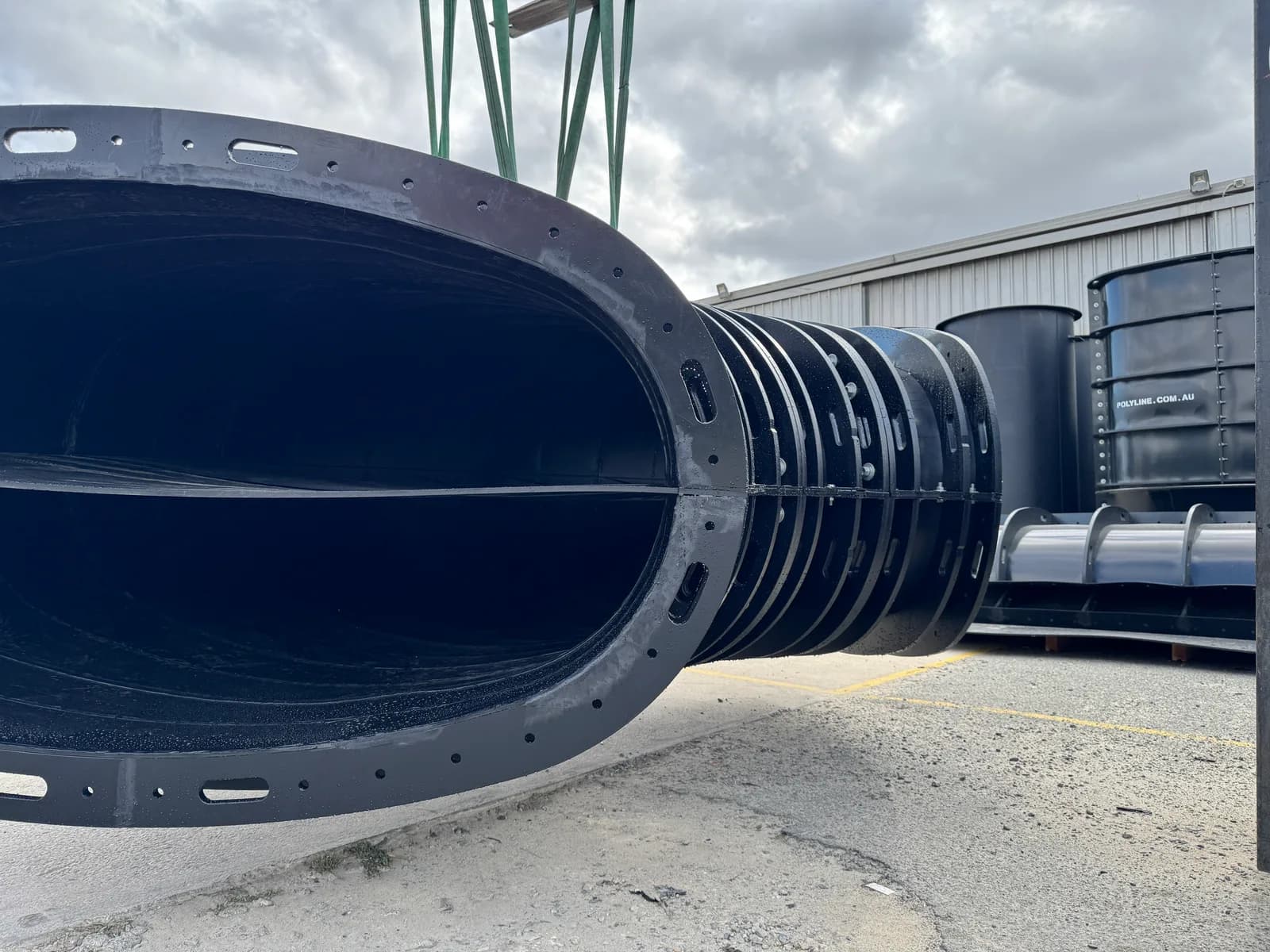 Low-profile oval duct run seen through the open flanged end