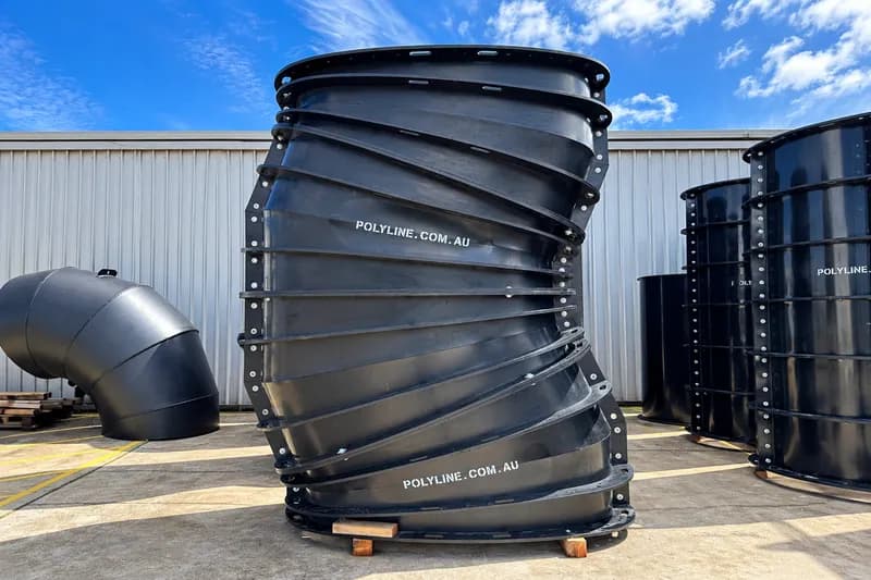 Large bolted segmented HDPE ducting bend standing in the Polyline yard